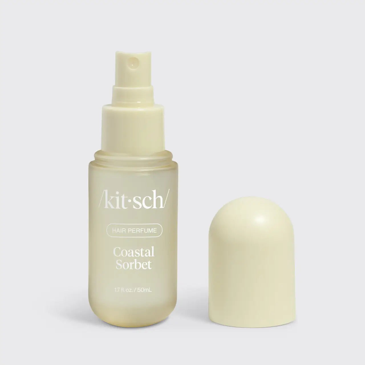 Kitsch Coastal Sorbet hair perfume bottle on a light gray background