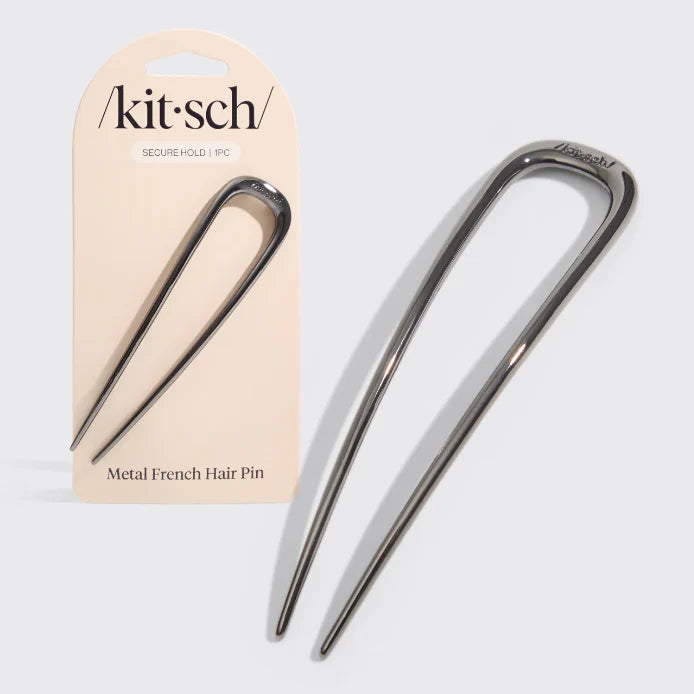 Metal French hair pin with packaging labeled 'kit·sch' on a light gray background