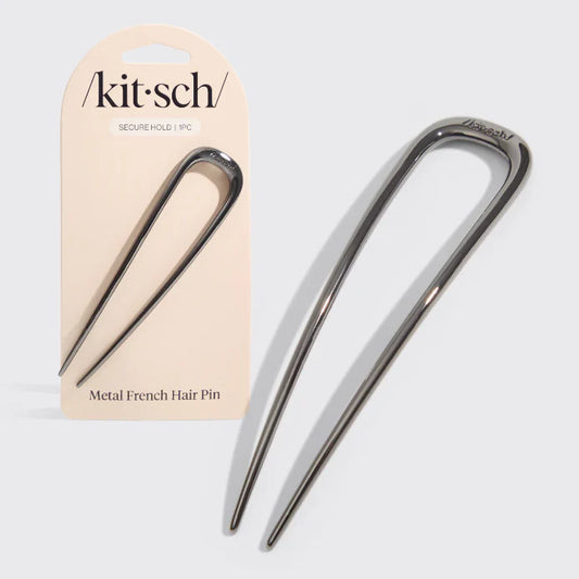 Metal French hair pin with packaging labeled 'kit·sch' on a light gray background