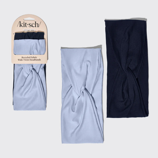 Two twisted headbands, one blue and one black, displayed with a 'kit-sch' packaging on a light gray background.
