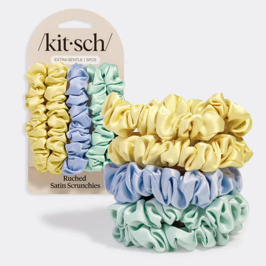 Set of ruched satin scrunchies in yellow, blue, and green with 'kitsch' packaging.