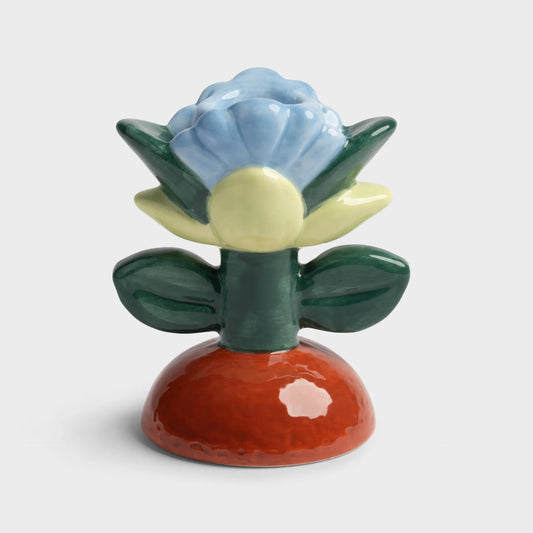 Colorful ceramic flower-shaped object on a white background