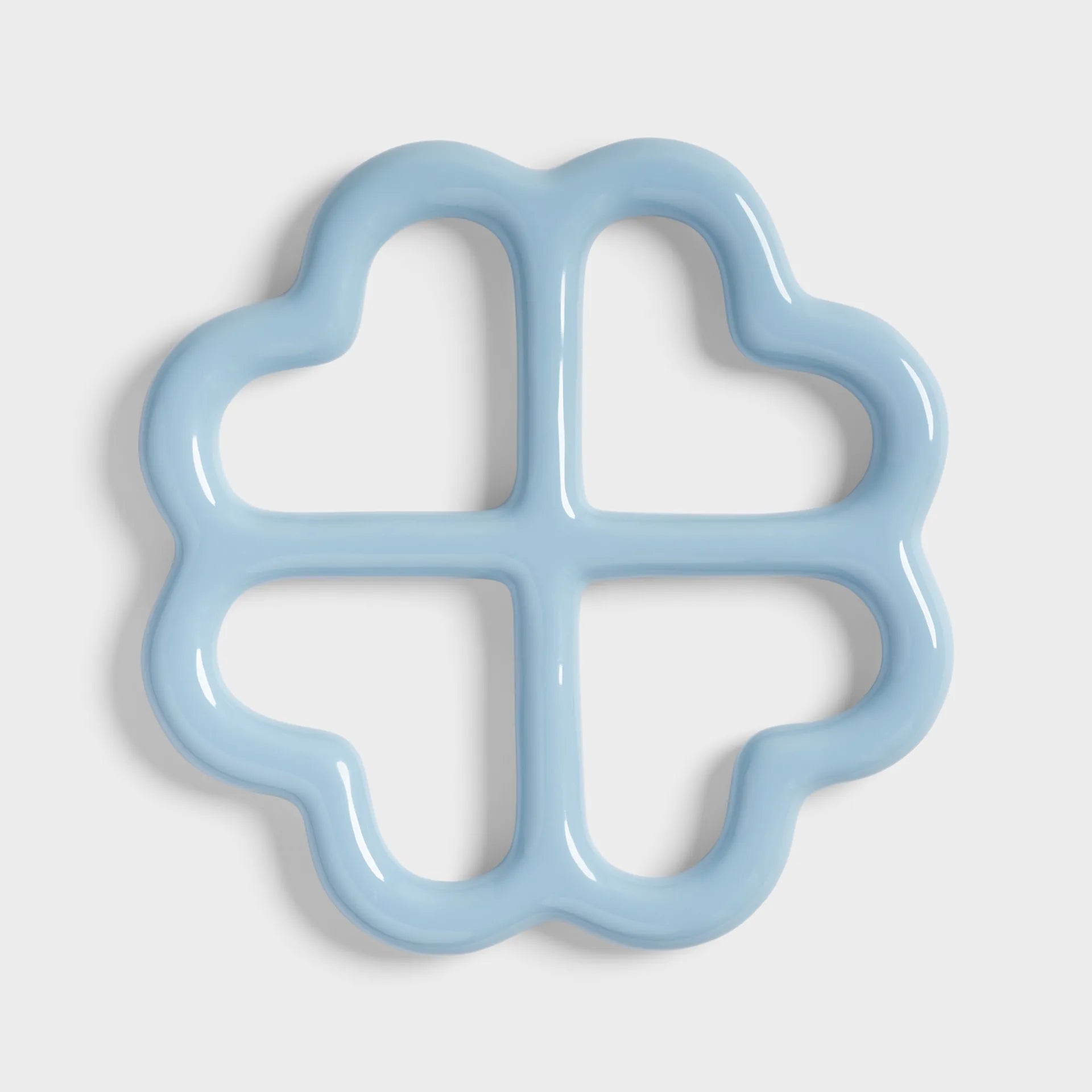 Light blue flower-shaped object on a white background