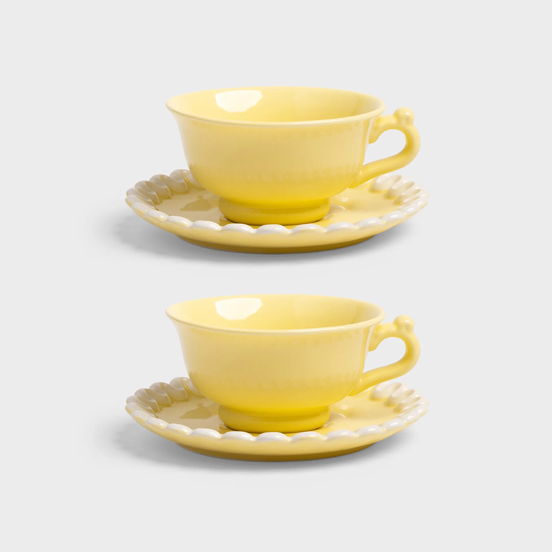 &Klevering Cup & Saucer Whip Yellow  on a white background 