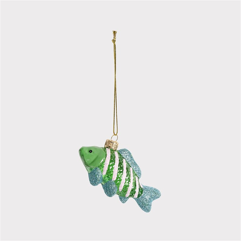 Green fish-shaped ornament with a gold chain on a white background