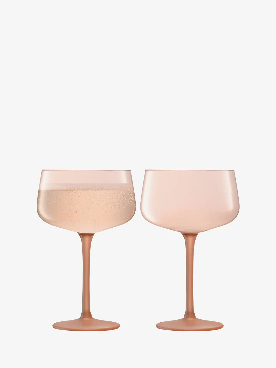 Two pink cocktail glasses on a white background