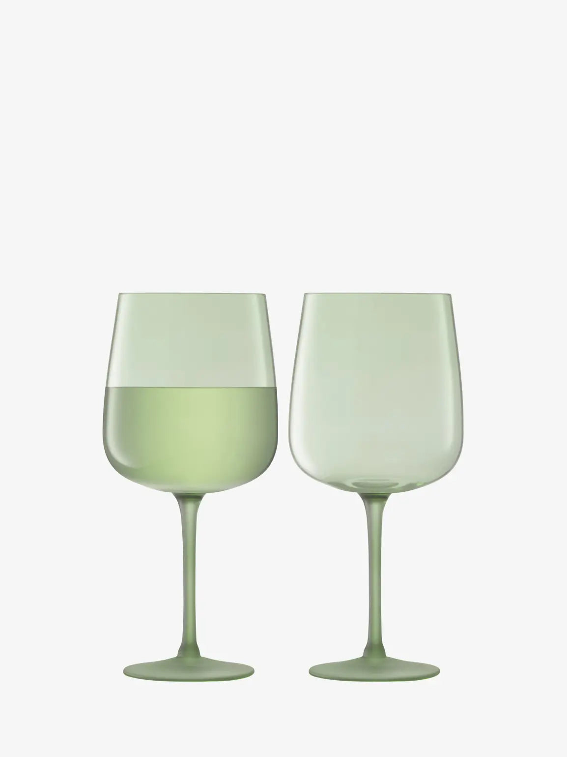 Two green wine glasses on a white background