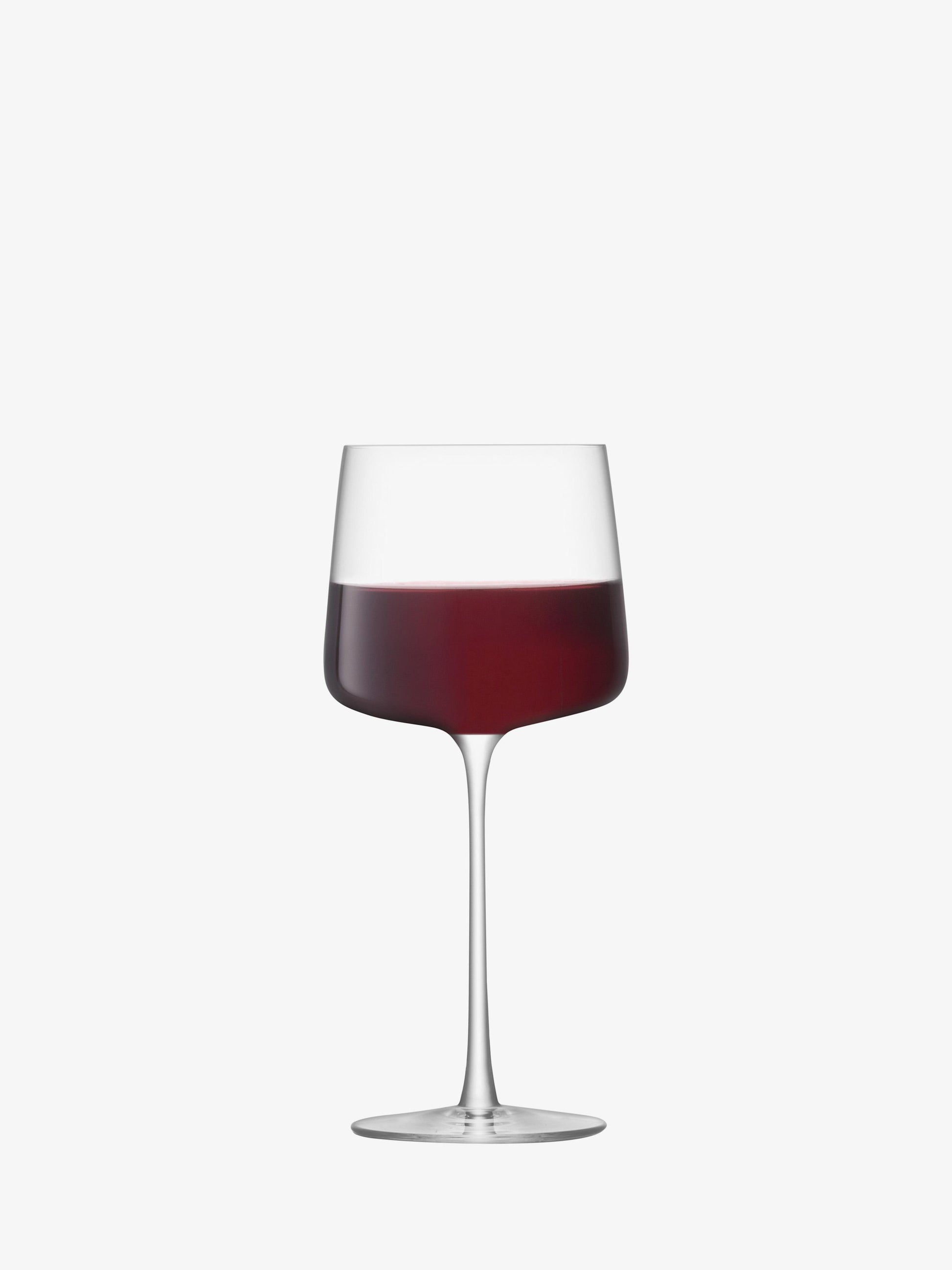 Wine glass with red wine on a white background