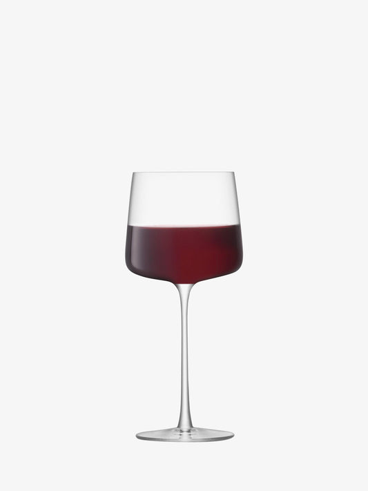 Wine glass with red wine on a white background