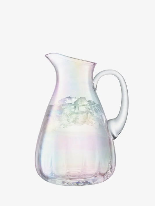 Iridescent glass pitcher on a white background