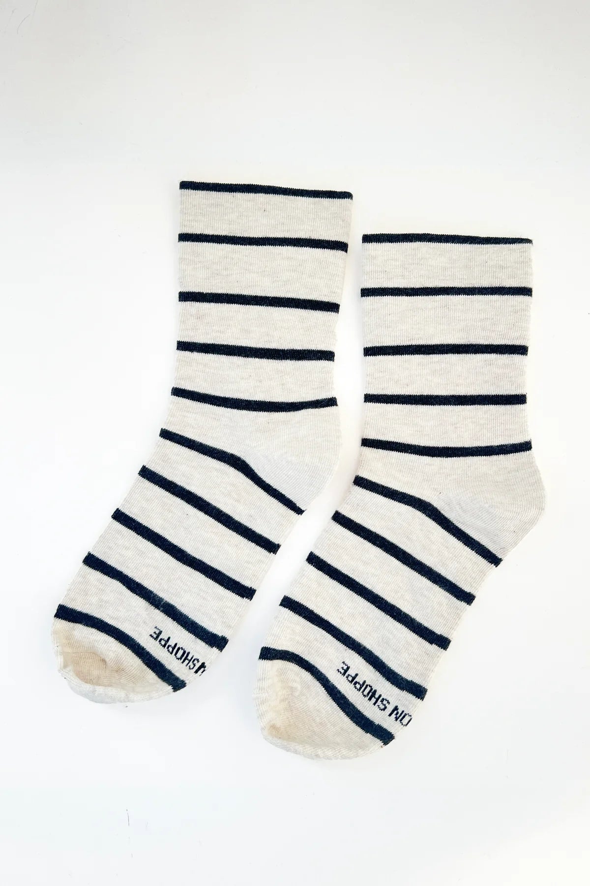 Pair of striped socks with visible brand name on a white background