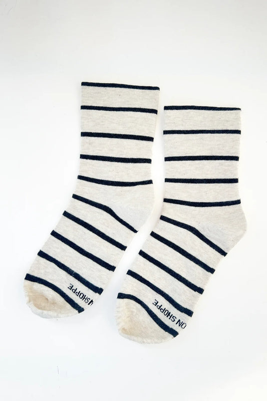 Pair of striped socks with visible brand name on a white background