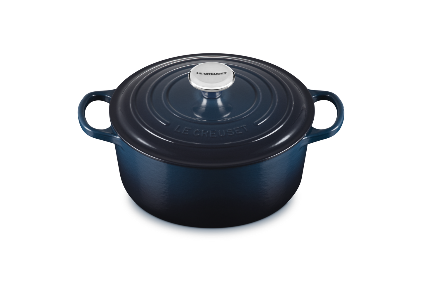 Blue round Le Creuset cocotte on a white background