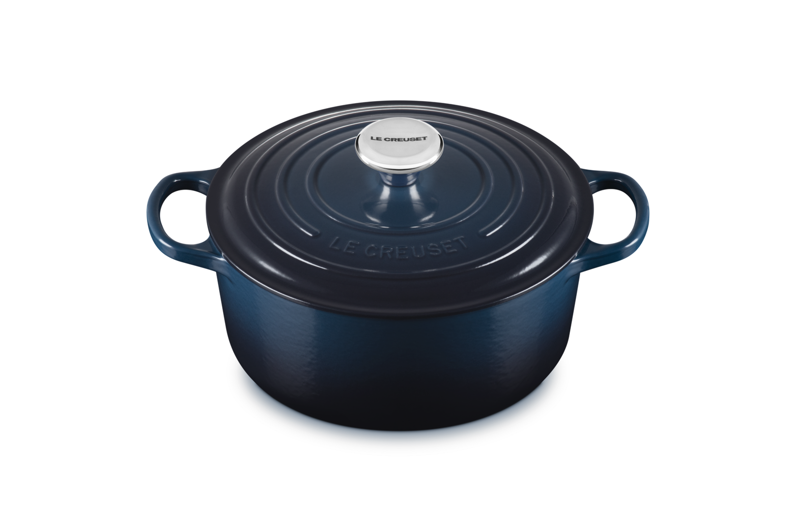 Blue round Le Creuset cocotte on a white background