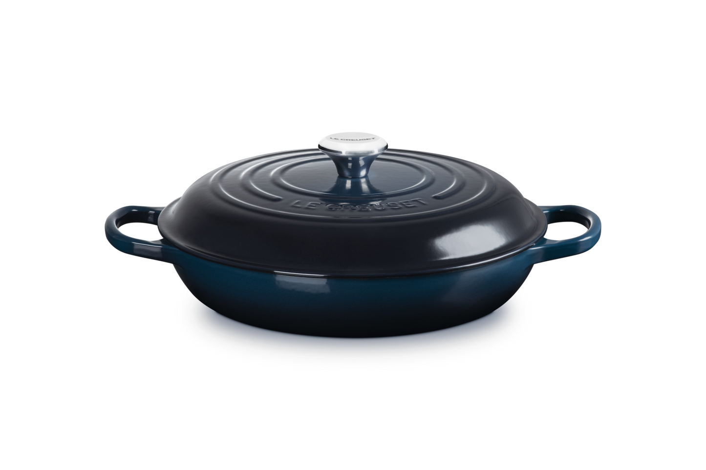 Blue cast iron skillet with lid on a white background