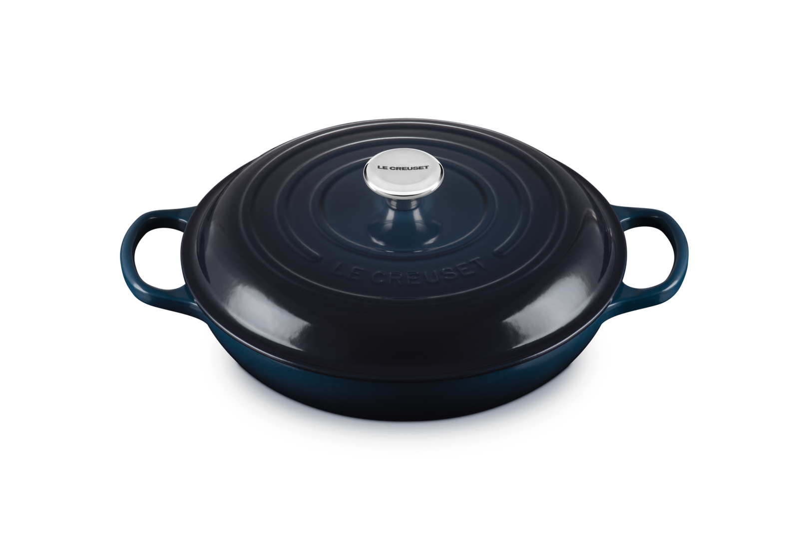 Blue enameled cast iron casserole dish with a lid on a white background