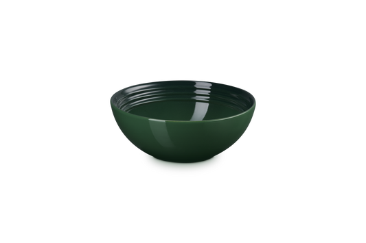 Green ceramic bowl on a white background