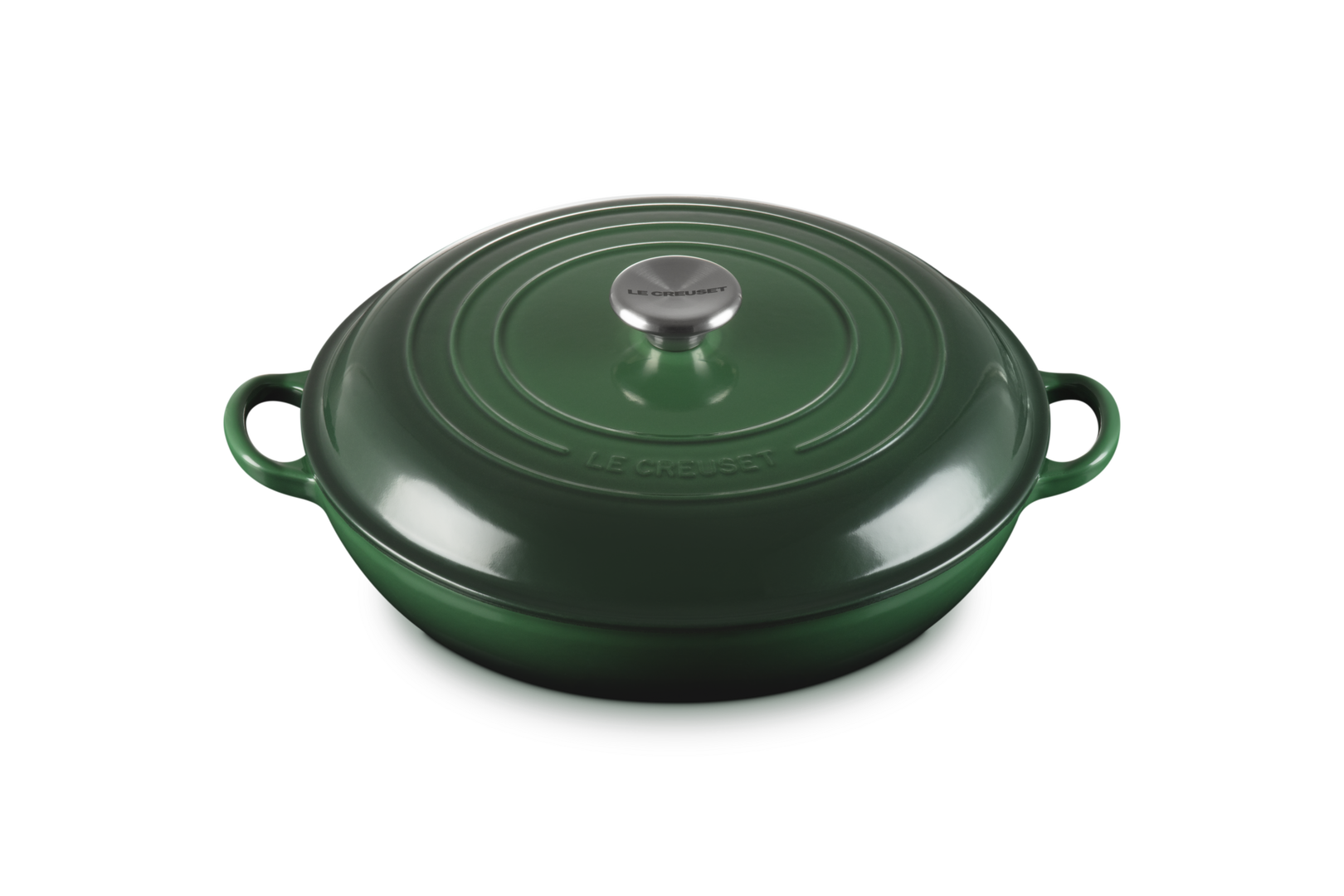 Green cast iron cookware with a lid on a white background