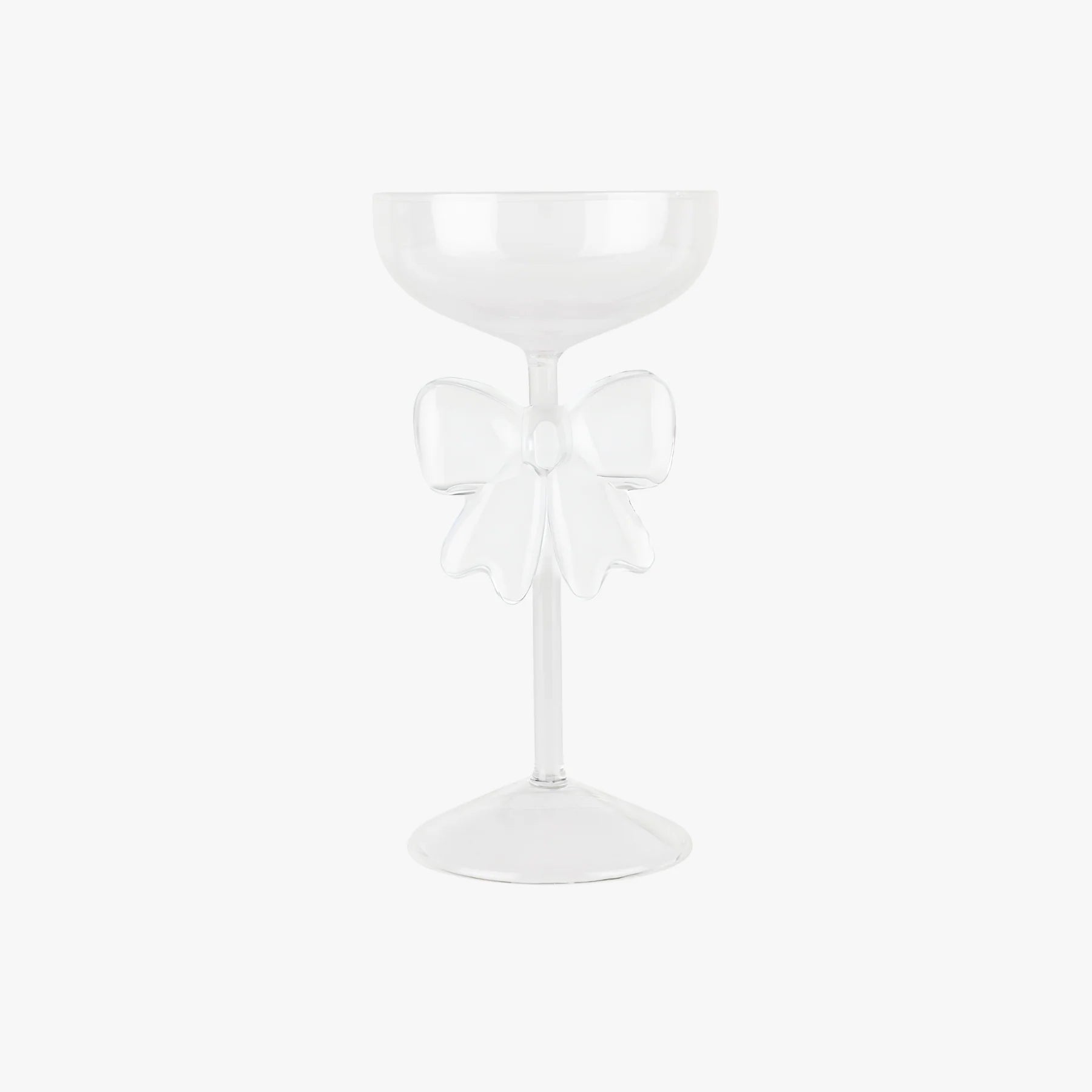 White glass with a decorative bow on a white background