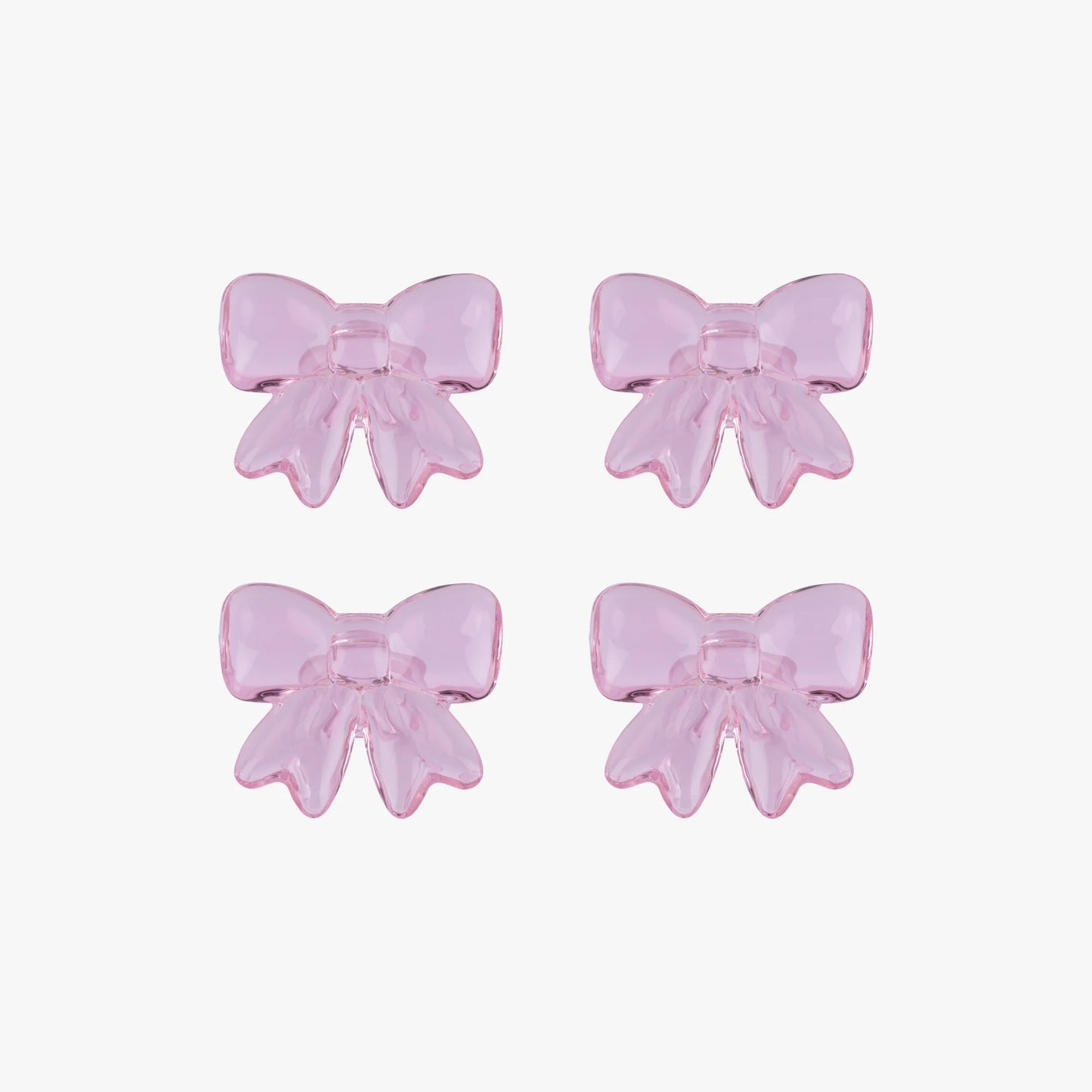 Four pink glass bows on a white background