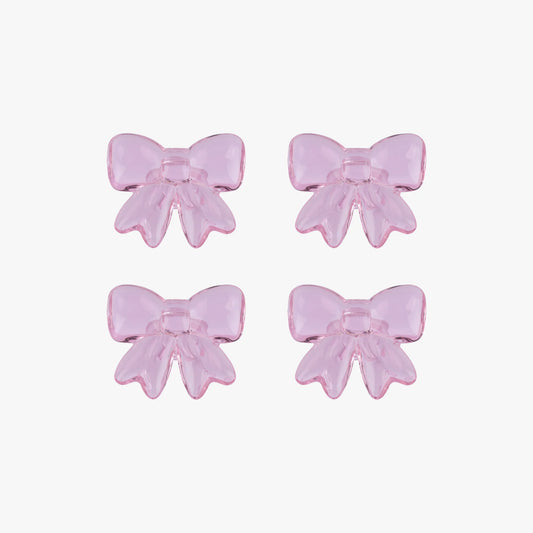 Four pink glass bows on a white background