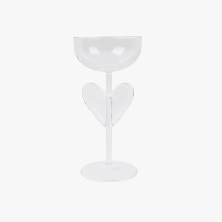 White champagne glass with heart-shaped design on a white background