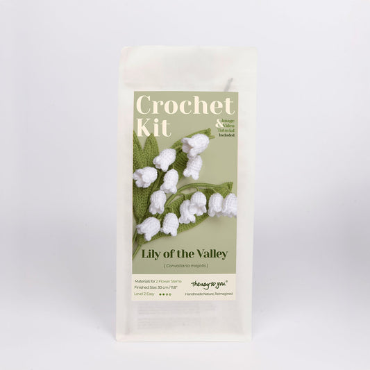 Crochet kit packaging with 'Lily of the Valley' design on a light gray background