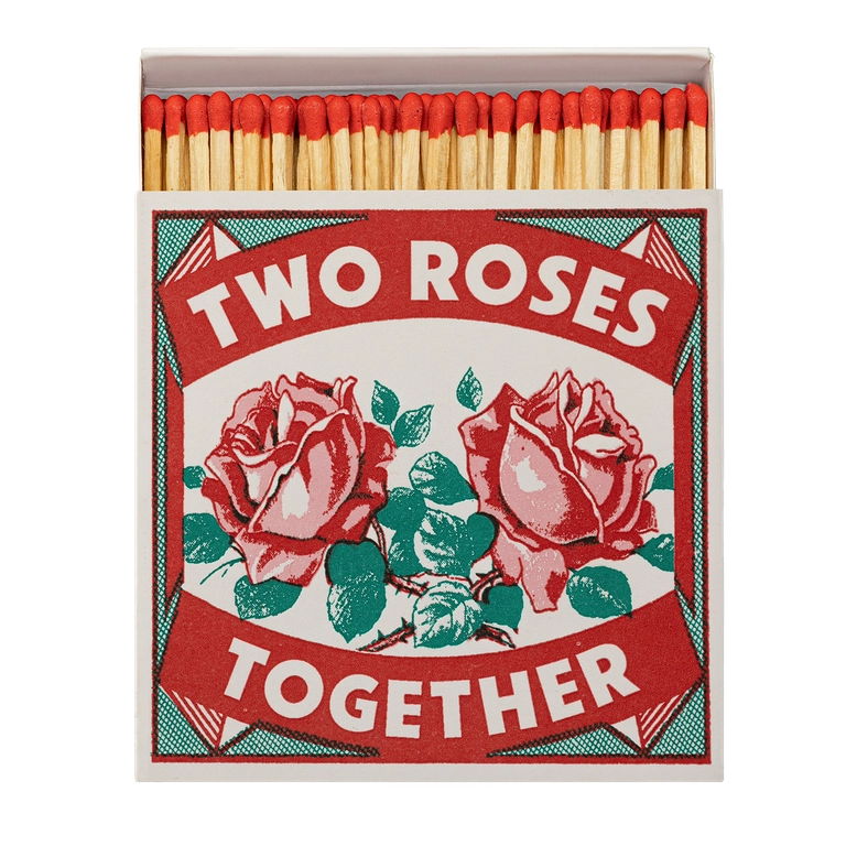 Matchbox with 'Two Roses Together' design on a white background