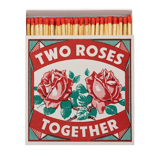 Matchbox with 'Two Roses Together' design on a white background