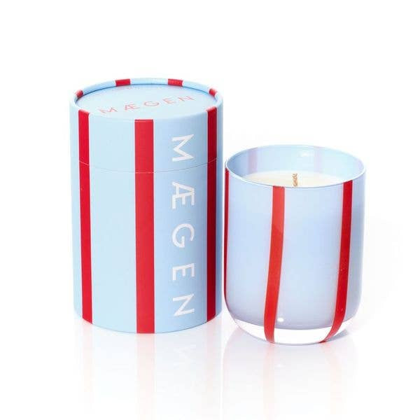 Candle with a striped container on a white background
