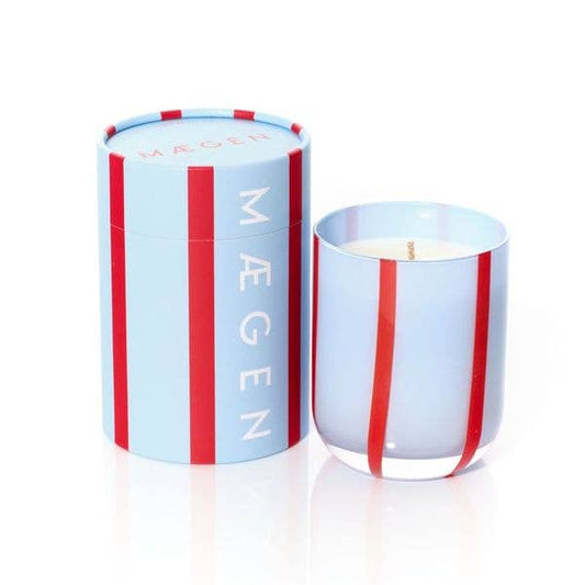 Candle with a striped container on a white background