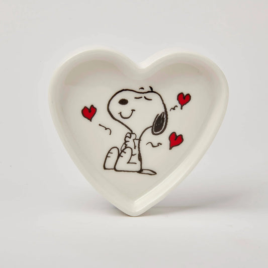 Heart-shaped ceramic dish with a cartoon character holding hands with a heart design on a white background