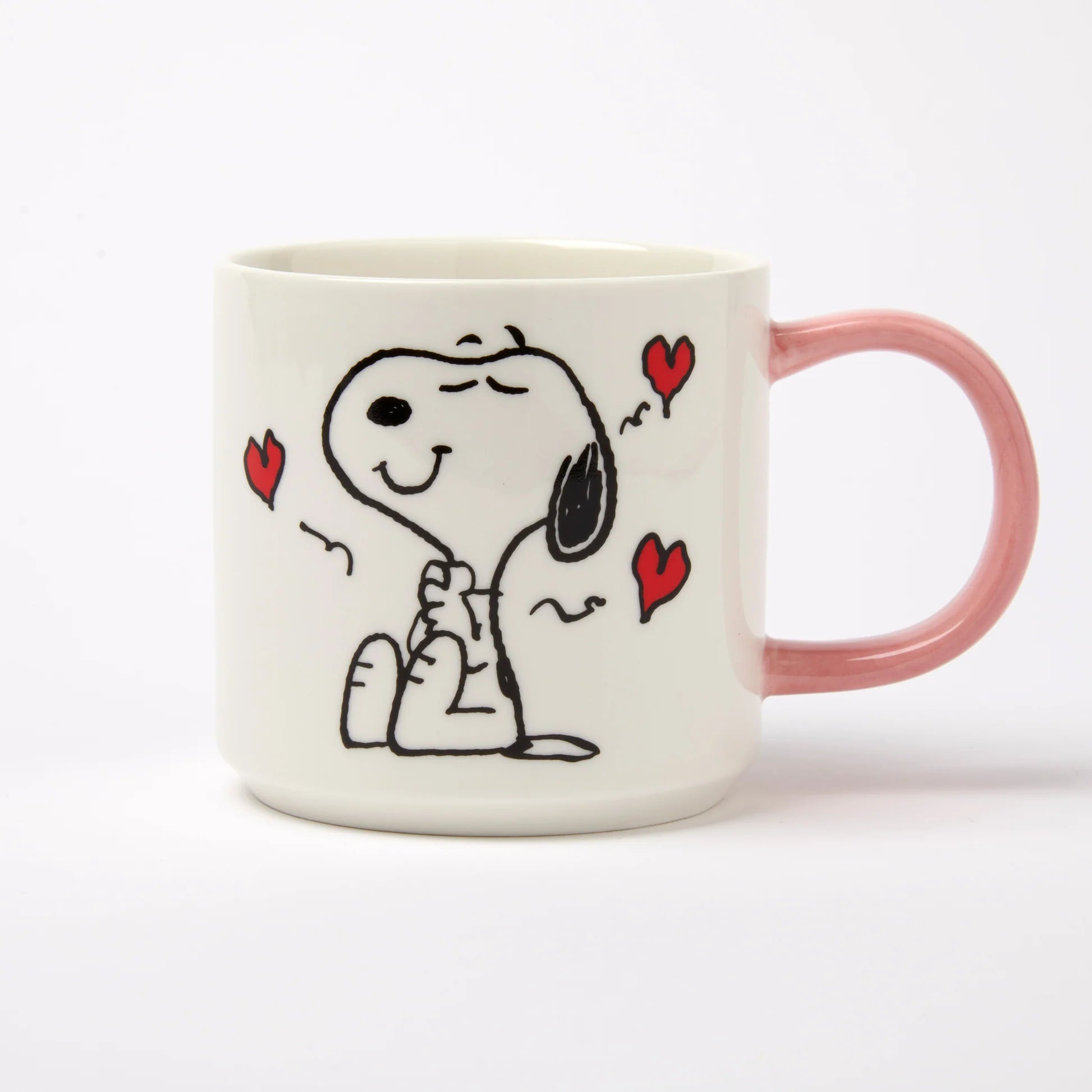 Mug with a cartoon dog design and red hearts on a white background