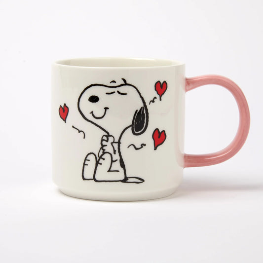 Mug with a cartoon dog design and red hearts on a white background