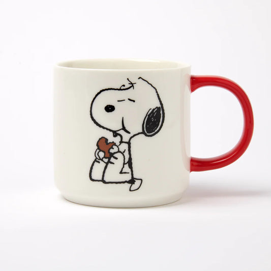 Mug with a cartoon character holding a gift on a white background