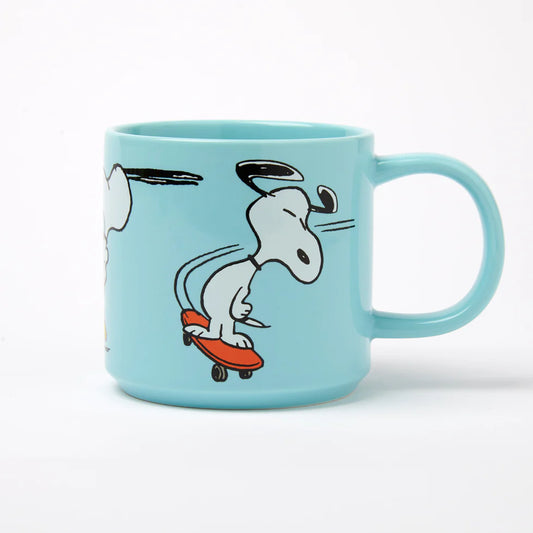 Light blue mug with a cartoon dog on a skateboard design