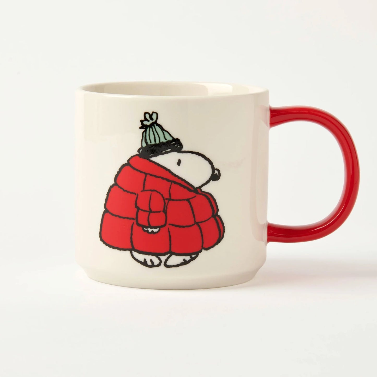 Mug with a cartoon character wearing a red coat and green hat on a white background