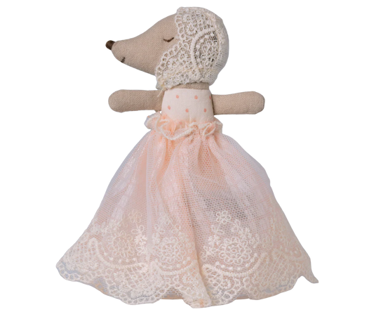 Stuffed animal toy with a lace dress on a white background