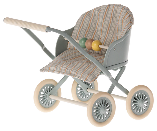 Toy stroller with patterned seat and colorful ball on a white background