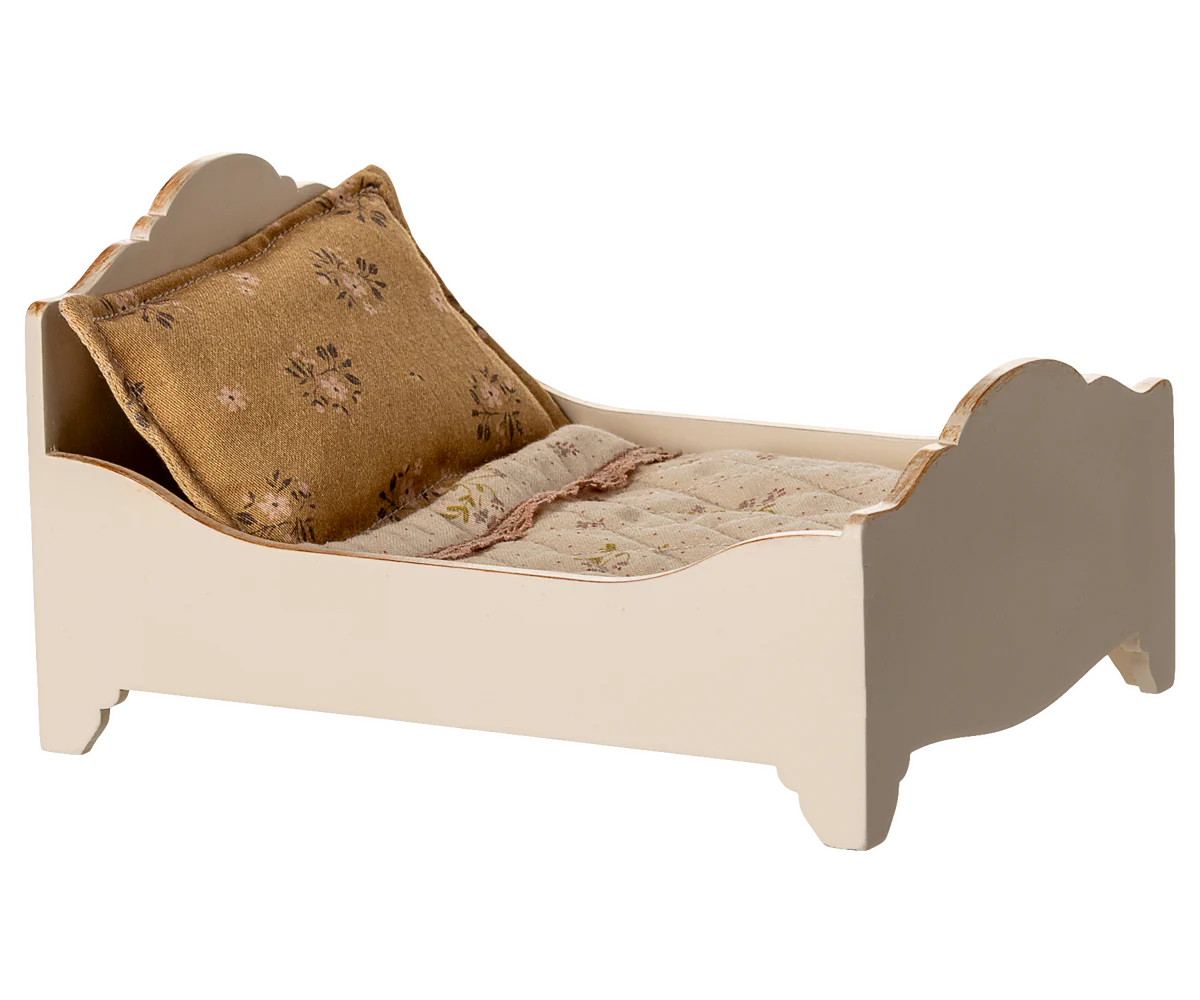 Small bed with a pillow and blanket on a white background for Maileg Dollhouse 