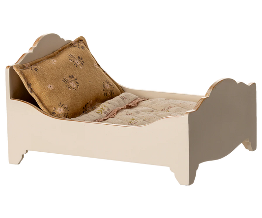 Small bed with a pillow and blanket on a white background for Maileg Dollhouse 