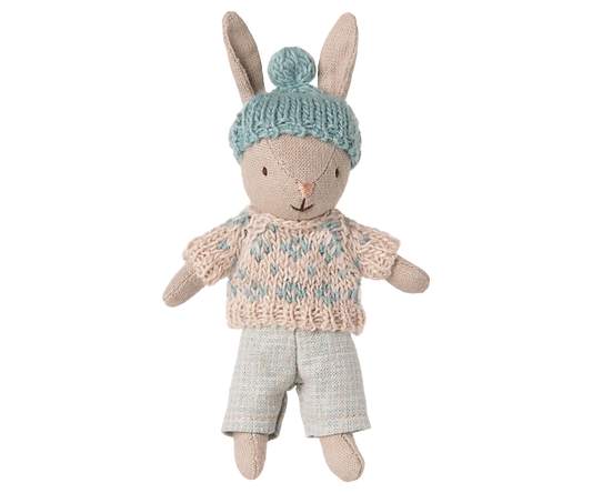 Toy Rabbit in knitted sweater and a hat on white background