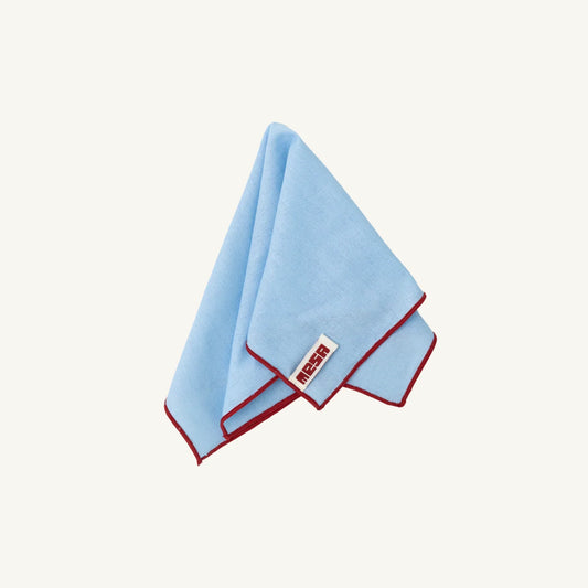 Mesa Collections Clear Sky Napkin with Red Trim on a white background