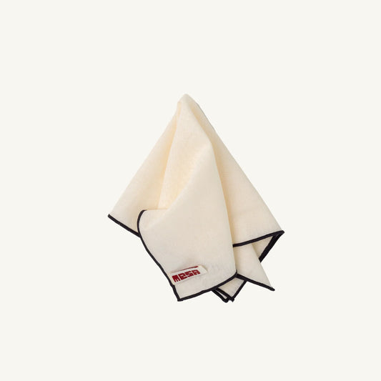 Folded napkin with a brand logo on a white background
