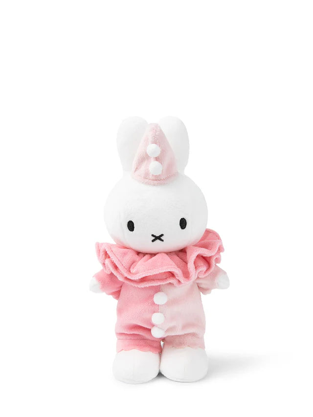 Plush toy with a white face and pink outfit on a white background
