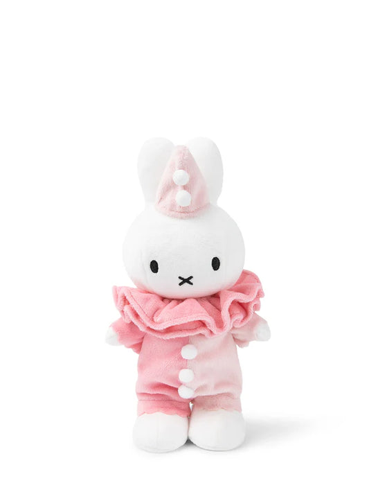 Plush toy with a white face and pink outfit on a white background