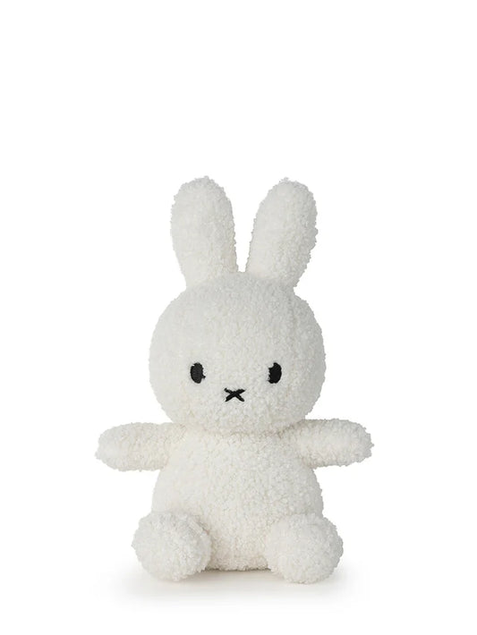 White plush bunny toy on a white background