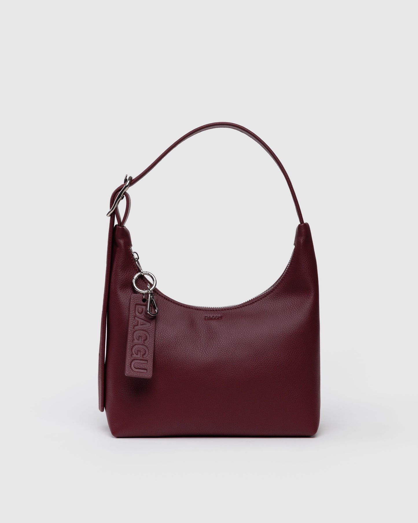 Burgundy handbag with a visible brand logo on a light gray background