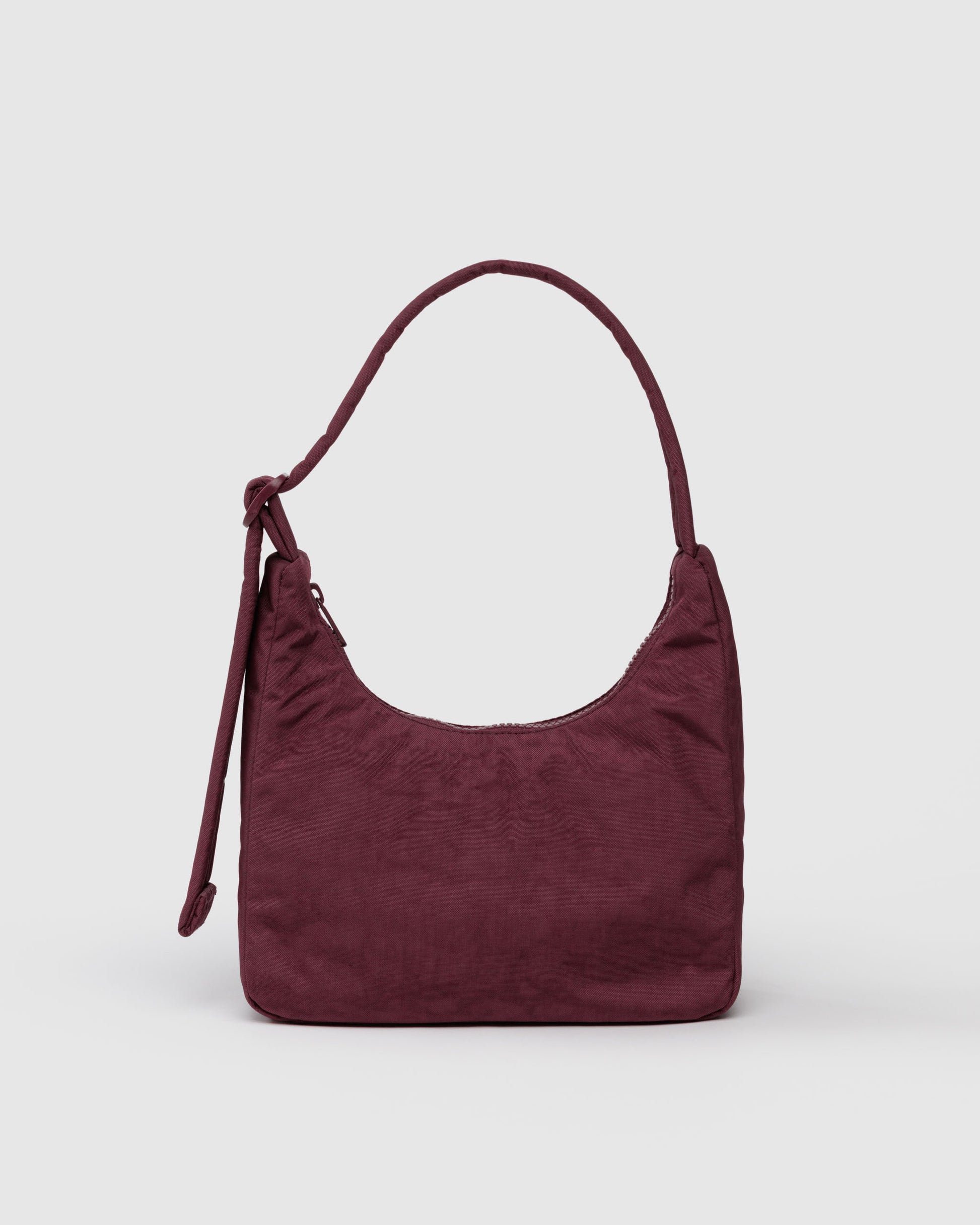 Maroon handbag on a light gray background