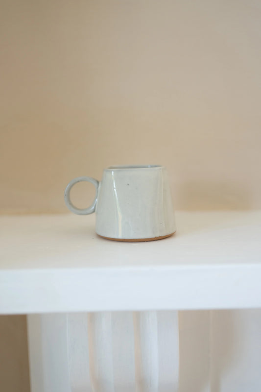 Morgan Wright Kaapi Cup in Milk colourway on a beige background 